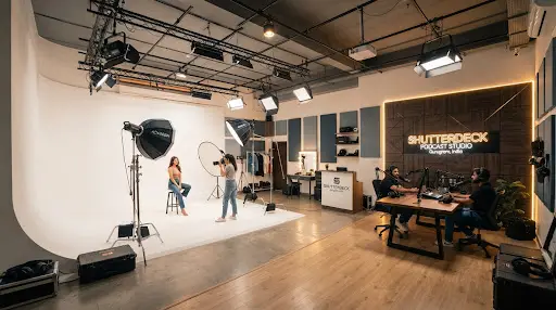 Shutterdeck studio floor in Gurugram with podcast set and white cyclorama